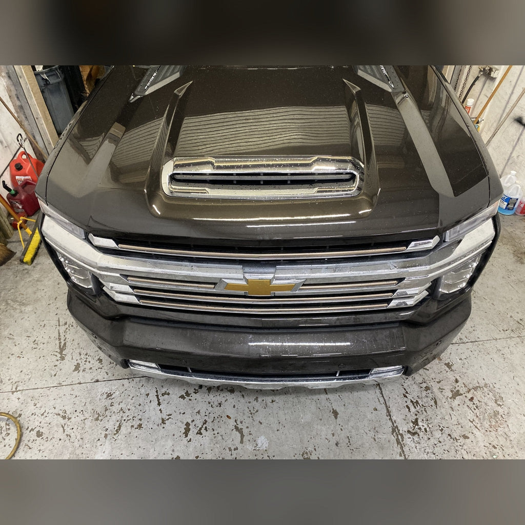 2020+ Chevy Silverado 2500HD/3500HD 3/4" front bumper spacer kit — installed view 3 showing bumper and tire clearance