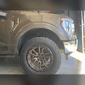 2021+ Ford F-150 with 3/4" front bumper spacer kit installed — bolt-on, no-cut tire clearance