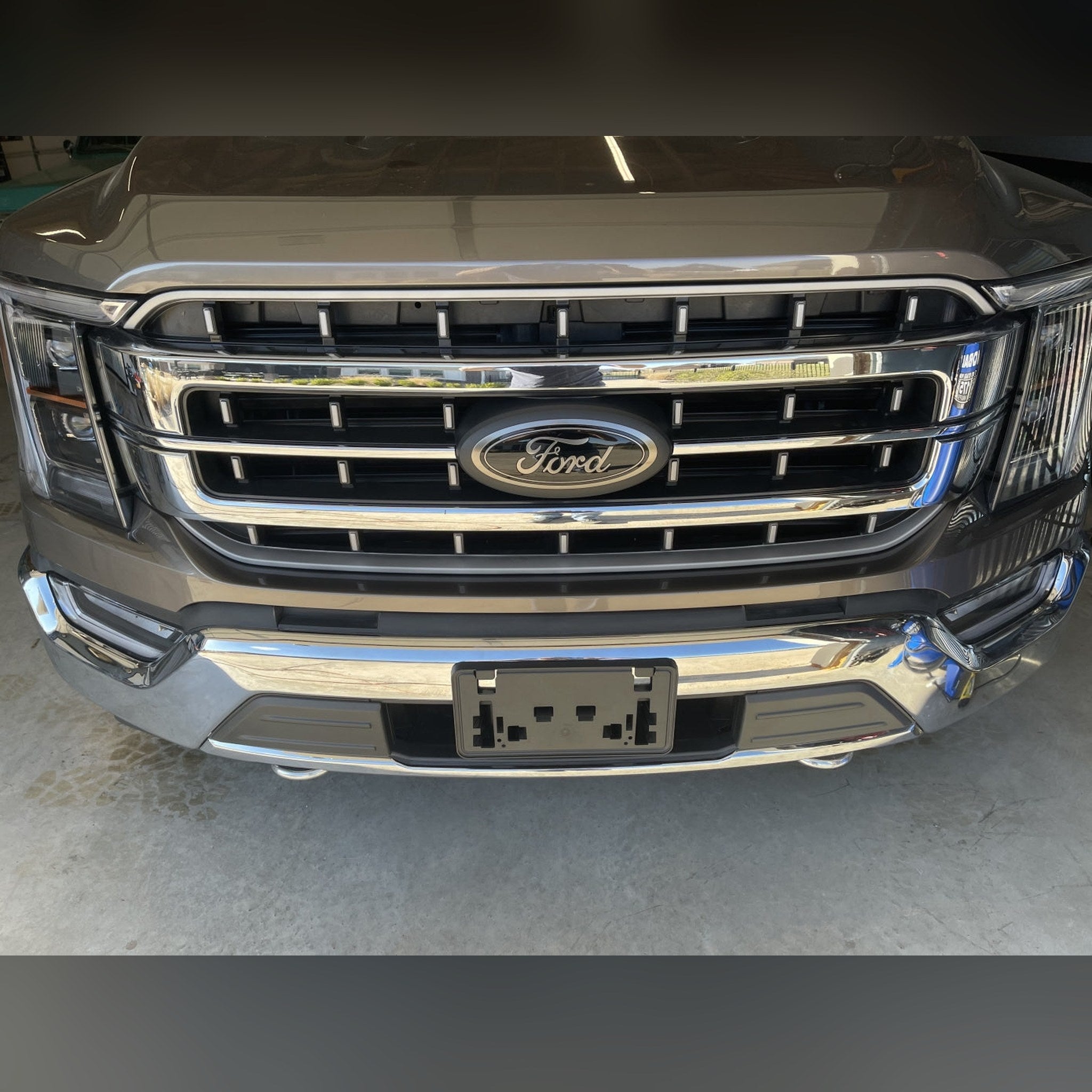 2021+ Ford F-150 3/4" front bumper spacer kit — installed view 3 showing bumper and tire clearance