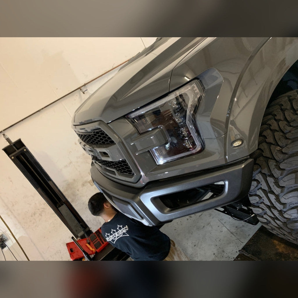 2018-2020 Ford F-150 Raptor 3/4" front bumper spacer kit — installed view 3 showing bumper and tire clearance