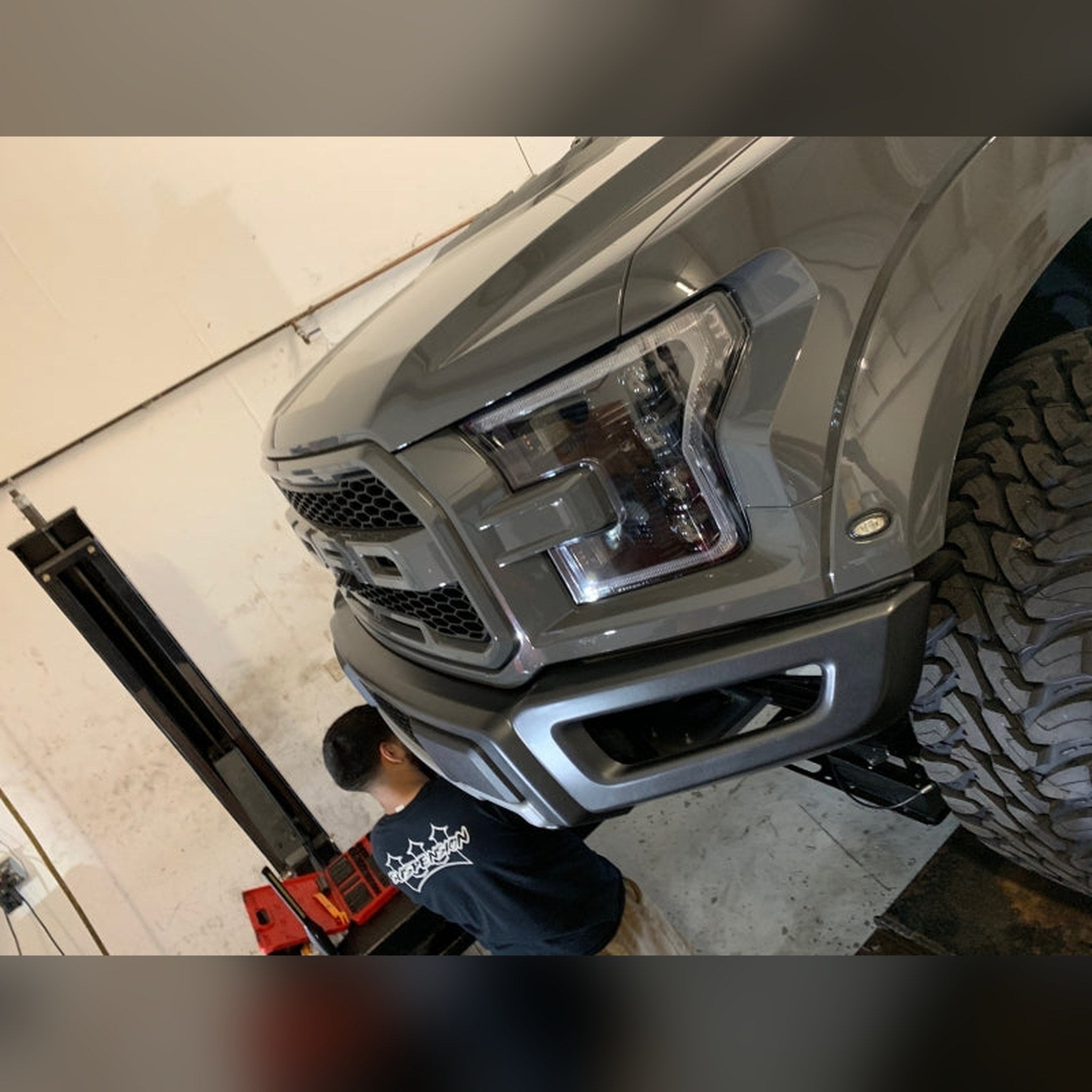 2018-2020 Ford F-150 Raptor 3/4" front bumper spacer kit — installed view 3 showing bumper and tire clearance
