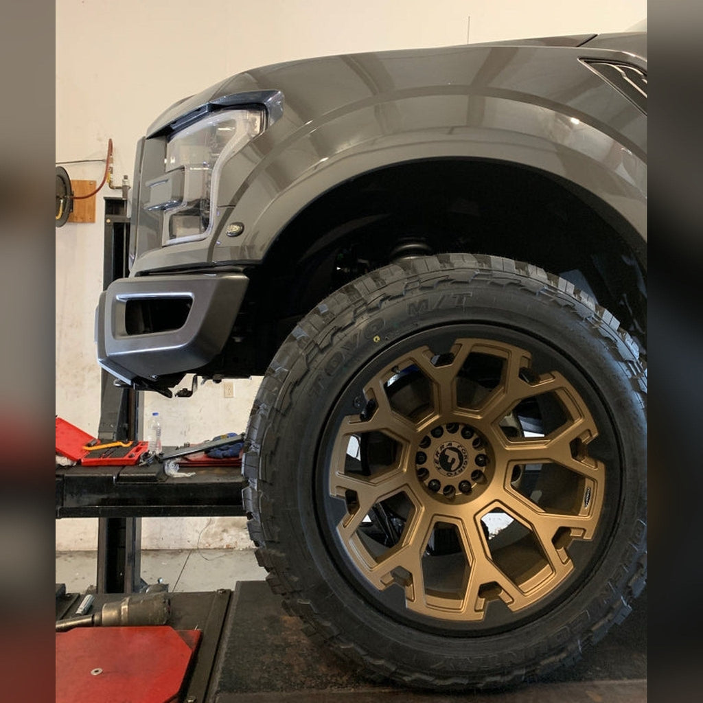2018-2020 Ford F-150 Raptor 3/4" front bumper spacer kit — installed view 4 showing bumper and tire clearance