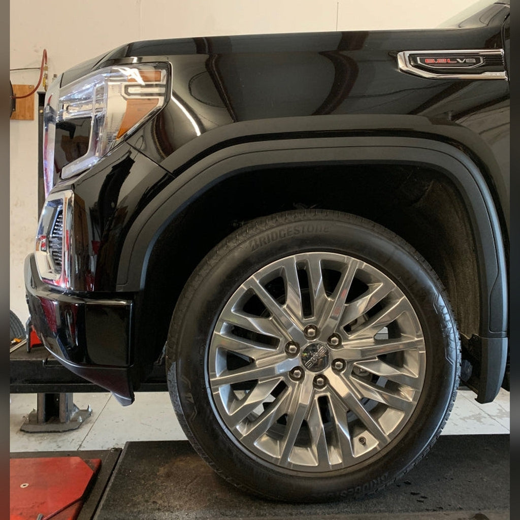2019+ GMC Sierra 1500 3/4" front bumper spacer kit — installed view 3 showing bumper and tire clearance