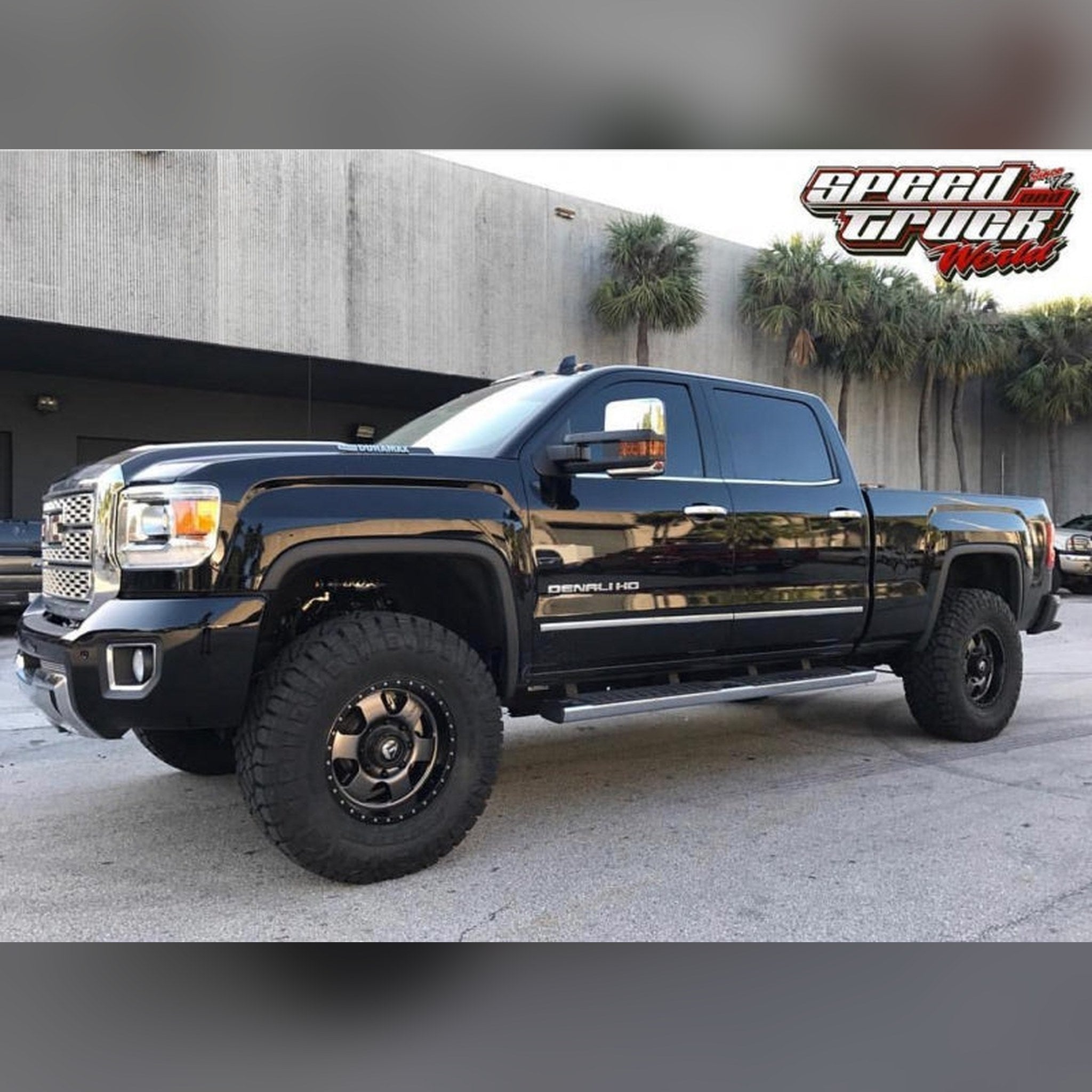2015-2019 GMC Sierra 2500HD/3500HD 3/4" front bumper spacer kit — installed view 2 showing bumper and tire clearance
